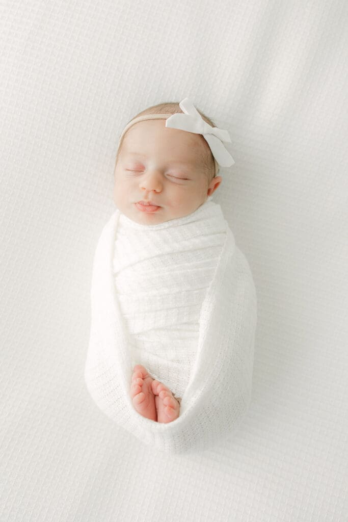 Sweet baby girl on beanbag | Adrienne Elizabeth Photography